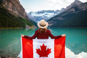 Woman draped Canadian flag