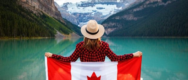 Woman draped Canadian flag