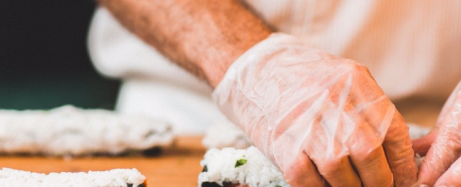 California rolls being rolled. California rolls