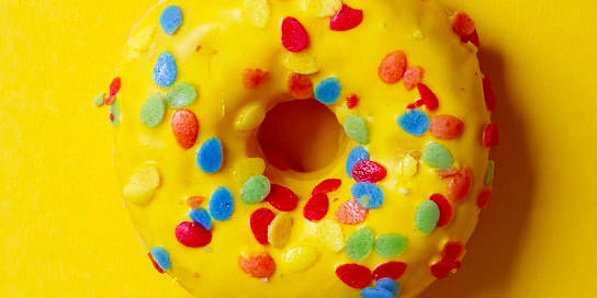 A fun-loving donut with sprinkles. donut with sprinkles