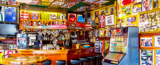 Soccer jerseys and memorabilia from floor to ceiling in this bar. soccer sports bar