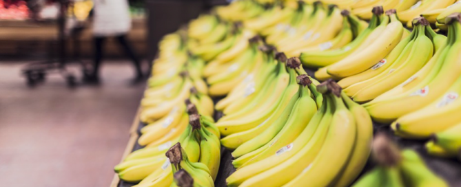 A row of bananas at the supermarket. supermarket banana